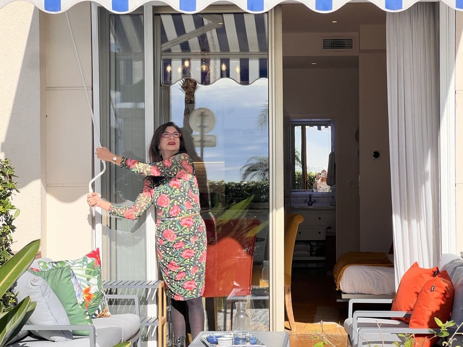 Adrian showing you how easy it is to open the patio awning at 99 Prom in Nice, France