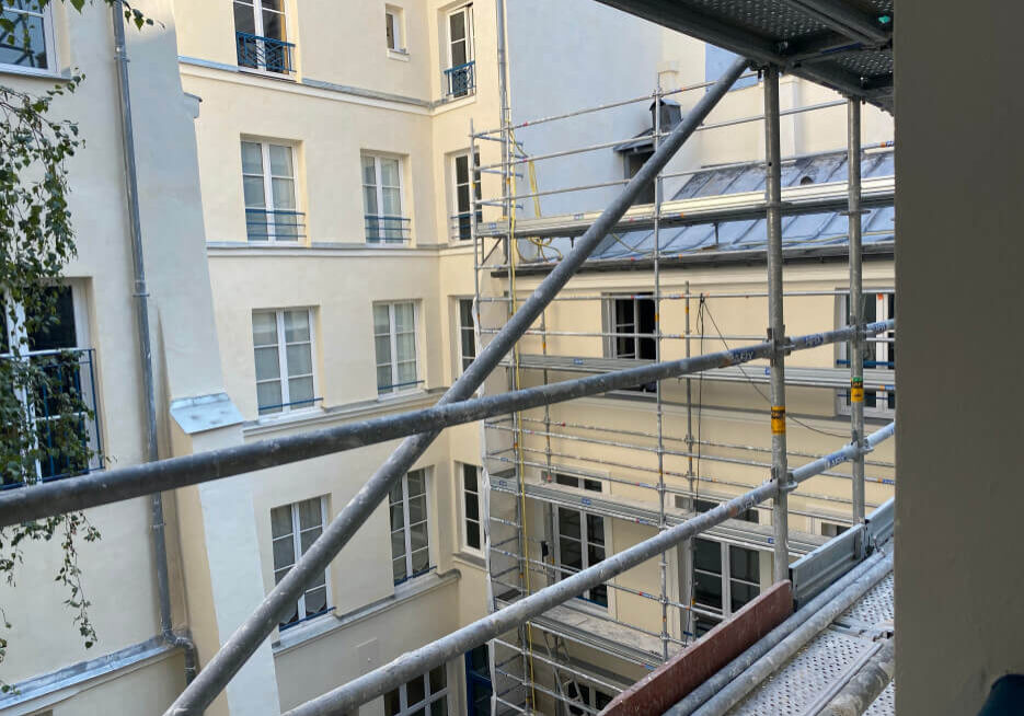 Looking through the scaffolding on a building