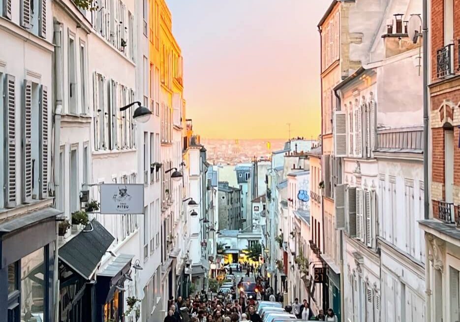 A view of the sunset down a street on Montmartre in Paris