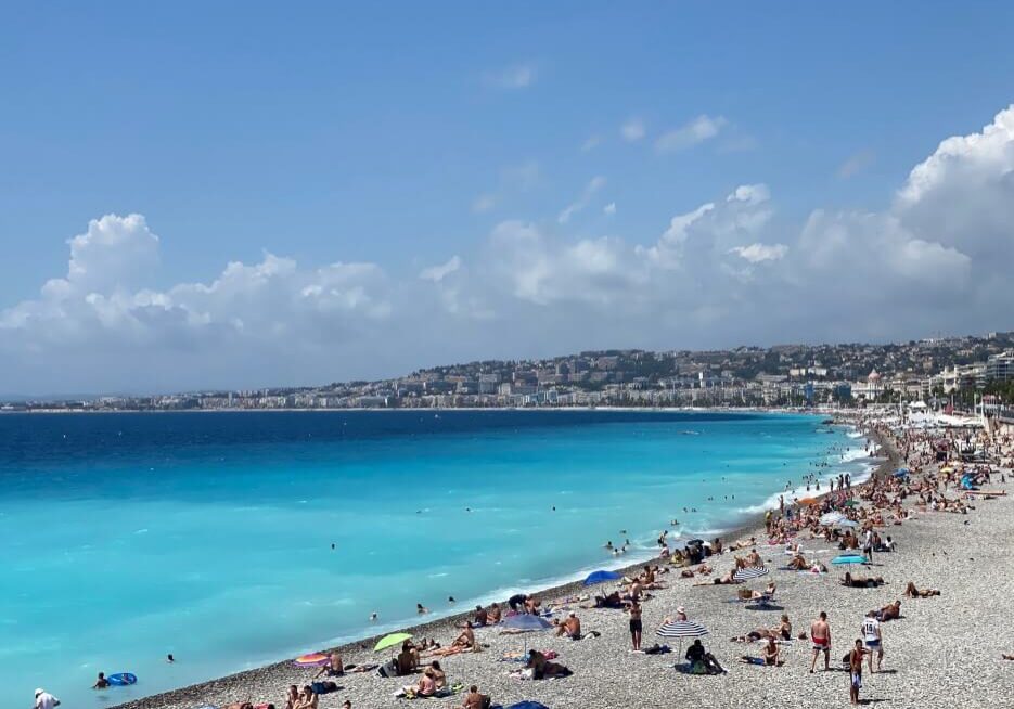 Sunbathers on the beach at the Baie des Anges in Nice
