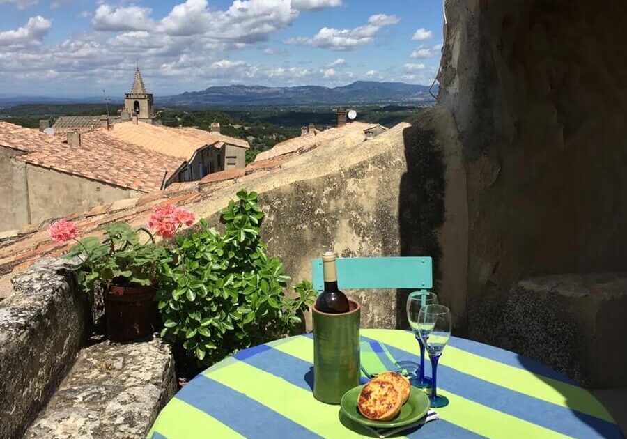 On the terrace of the apartment for sale, looking out over Venasque, France in the Vaucluse