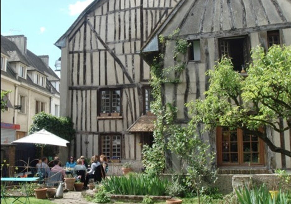 exterior of 1 rue Tatin, Louviers, Normandy with garden party