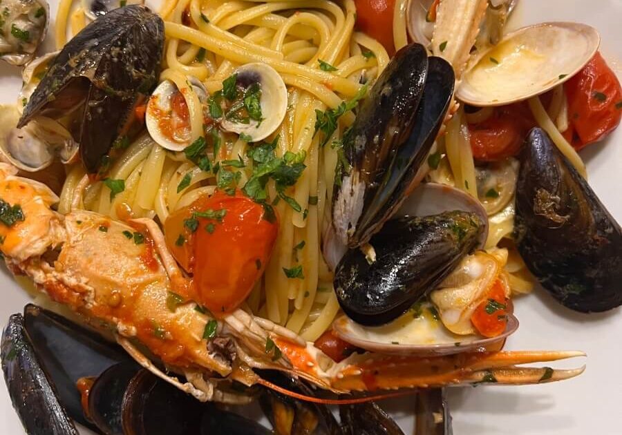 A bowl of Linguine alla scoglio at Osteria da Carmela in Naples, Italy