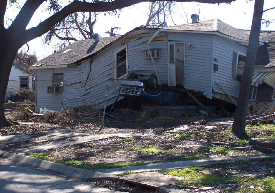 Car trapped underneath a collapsed house