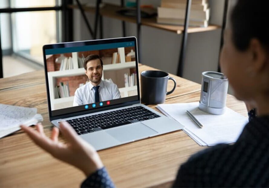 Photo demonstrating French Notaires working electronically by computer and conferencing