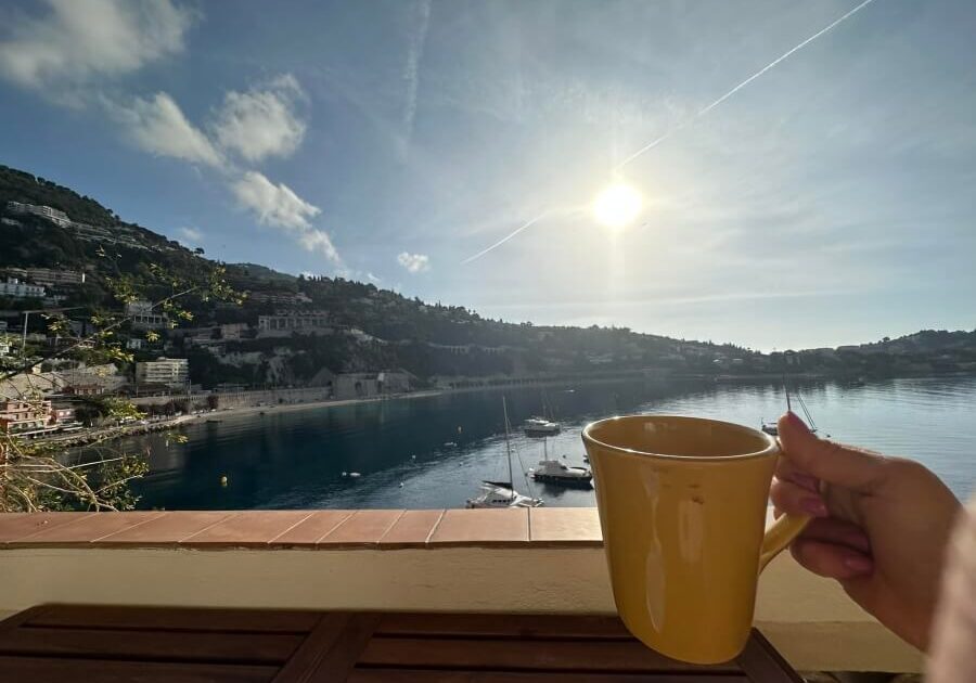 Enjoying a cup of coffee on the terrace of La Belle Terrasse fractional property in Villefranche-sur-Mer, France