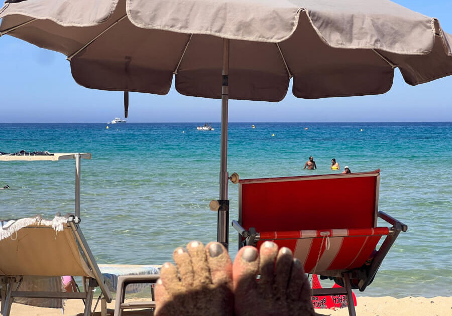 Toes in the sun on the beach in Nice, France
