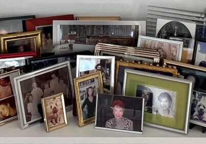 Adrian Leeds' collection of family photos displayed on her new bookshelves