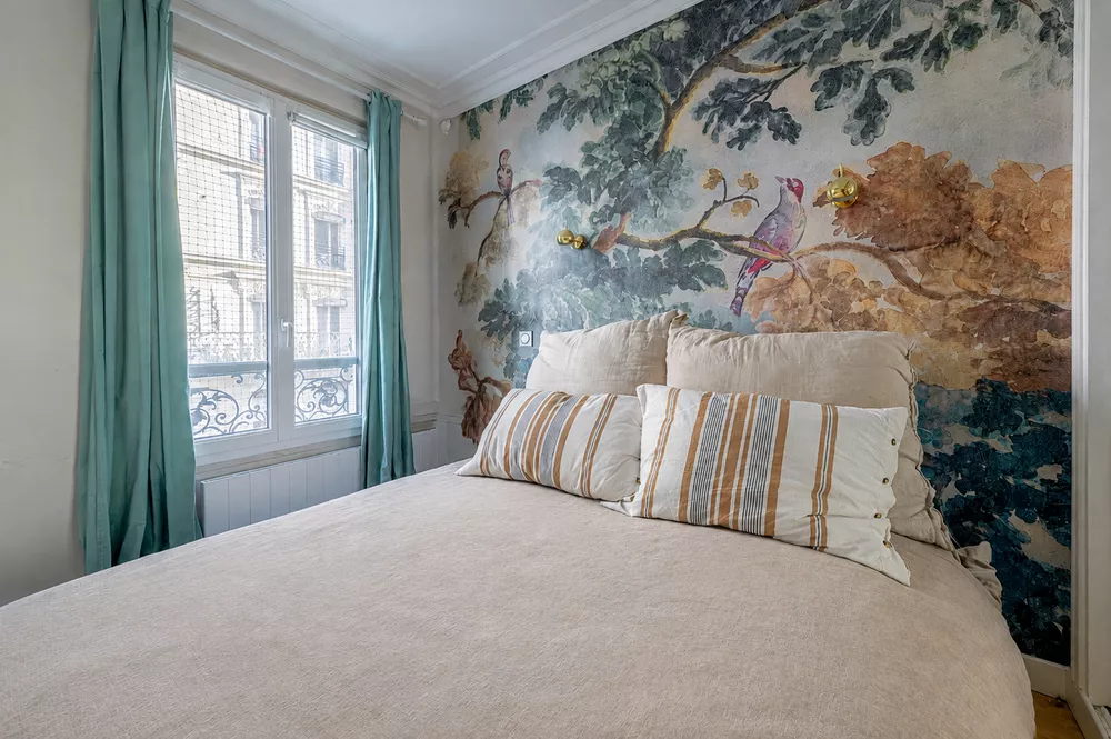 rue Sedaine Paris France large windows Custom mirrored wardrobe renovated to maximize storage, featuring 3 hanging racks alongside built-in drawers and shelving