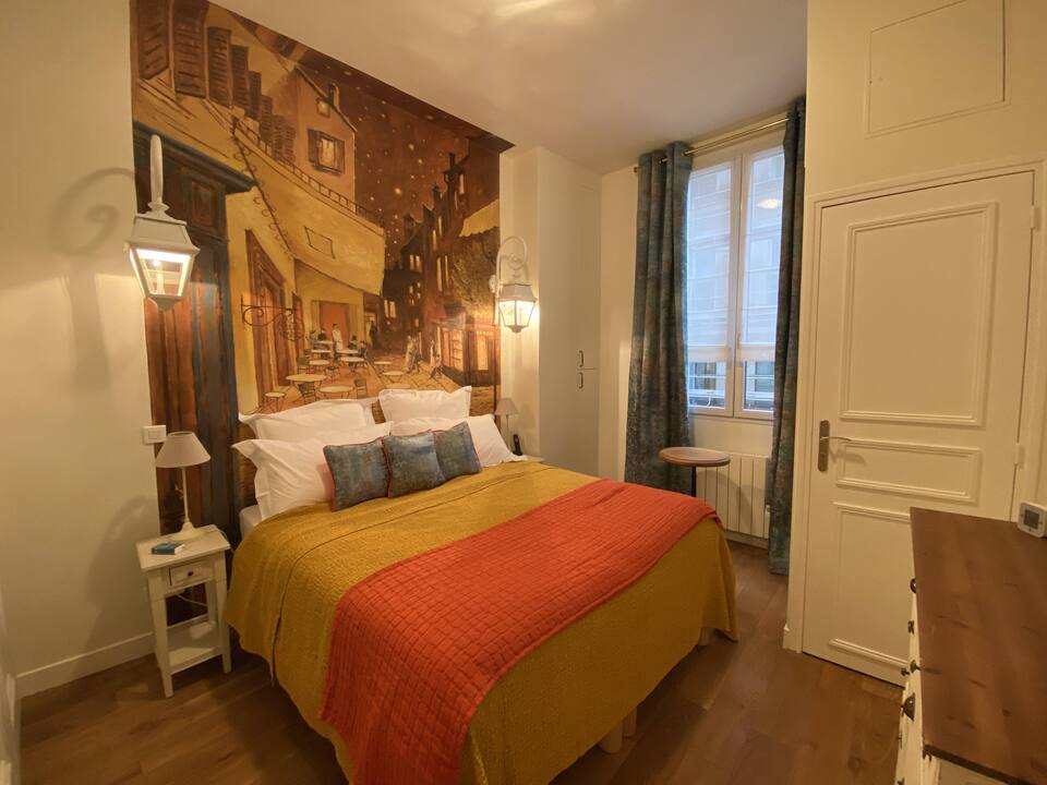 Custom mural in bedroom and nice window at La Lanterne