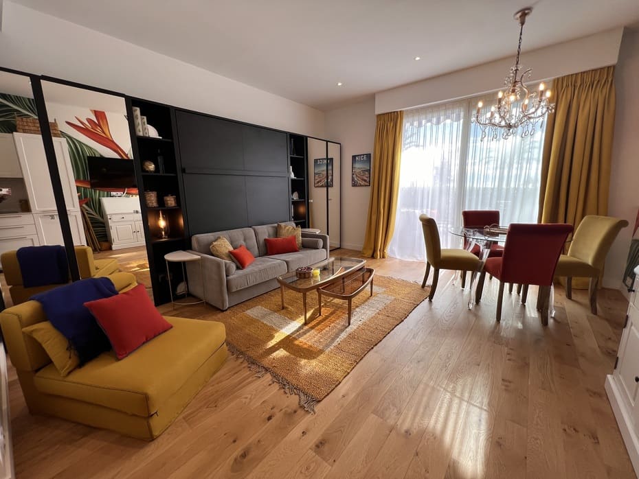 View from the kitchen to the living dining area showing the sofa with the bed up