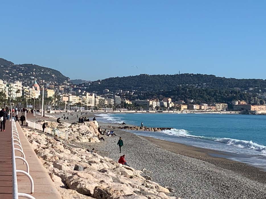 Ocean and beach across Promenade des Anglais