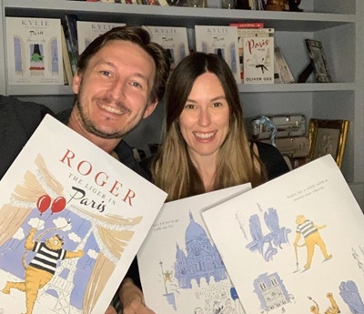 Oliver Gee and Lina Nordin Gee showing the cover of Roger the Liger in Paris and Lina's illustrations 
