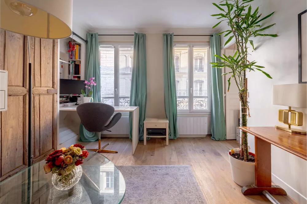 rue Sedaine Paris France salon living area with large windows and a fold away desk