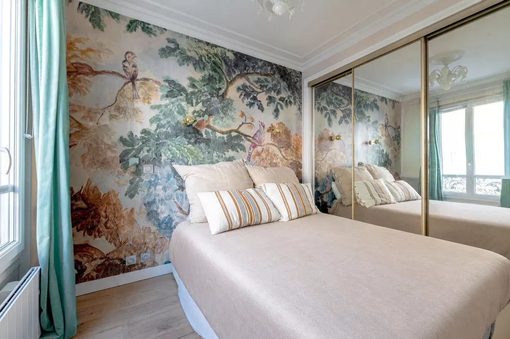 lots of closet space in bedroom at rue Sedaine Paris France