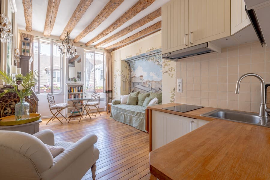 Kitchen with view to living and dining at rue Volta Paris